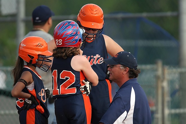 A coach providing personalized instruction to a young athlete.